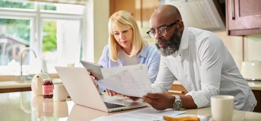 Couple reviewing finances with documents