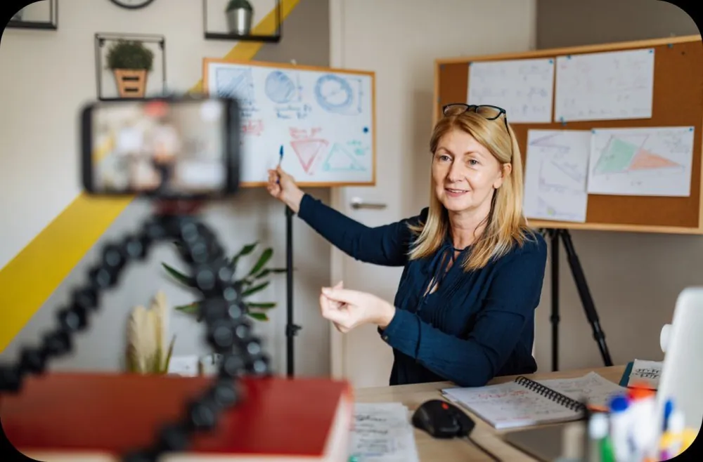 Workshop trainer presenting at a whiteboard